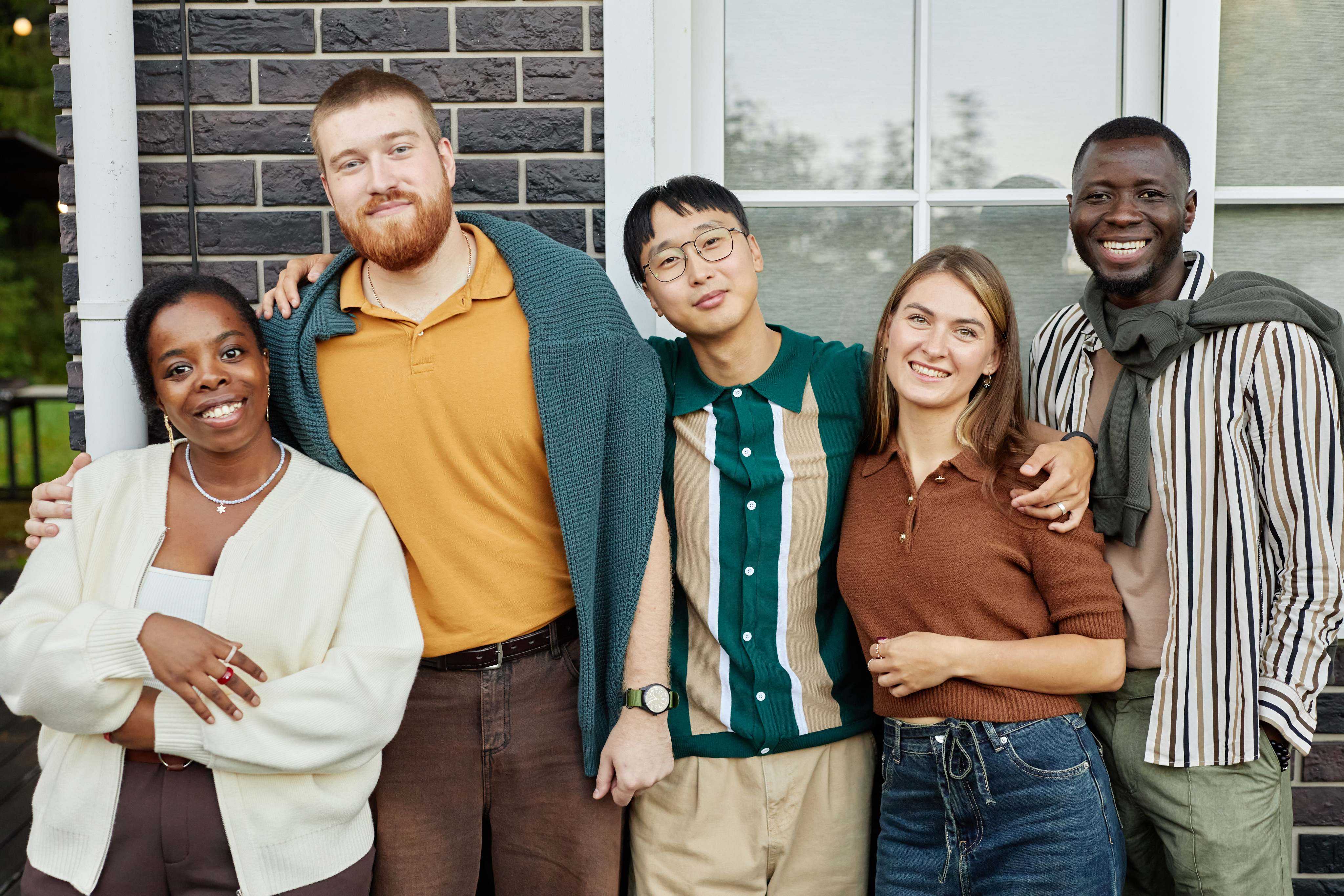 Renters standing together outside a home