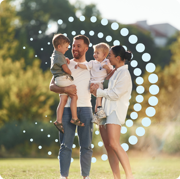 Family standing outdoors with dotted circular pattern