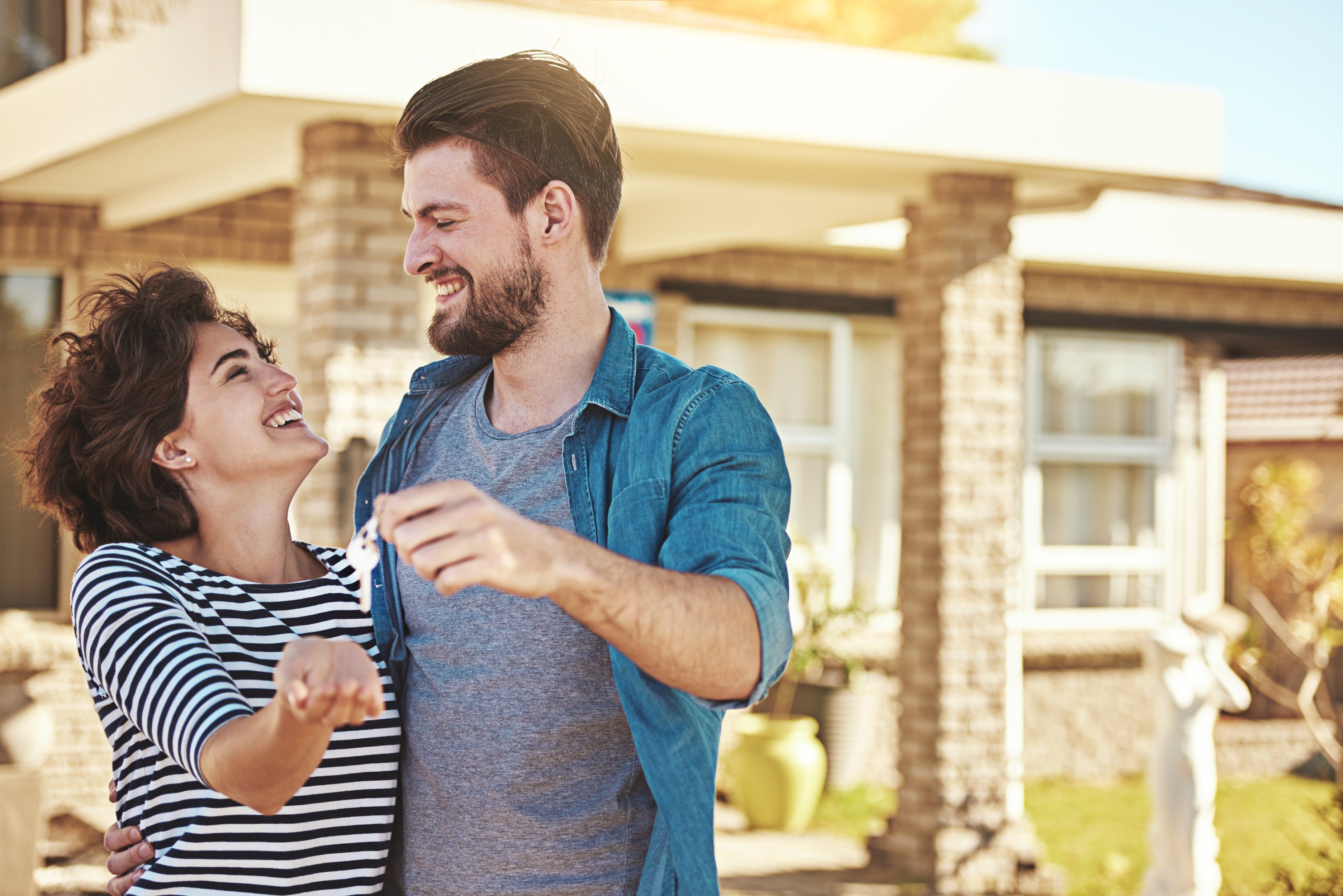 Customer smiling outside their home